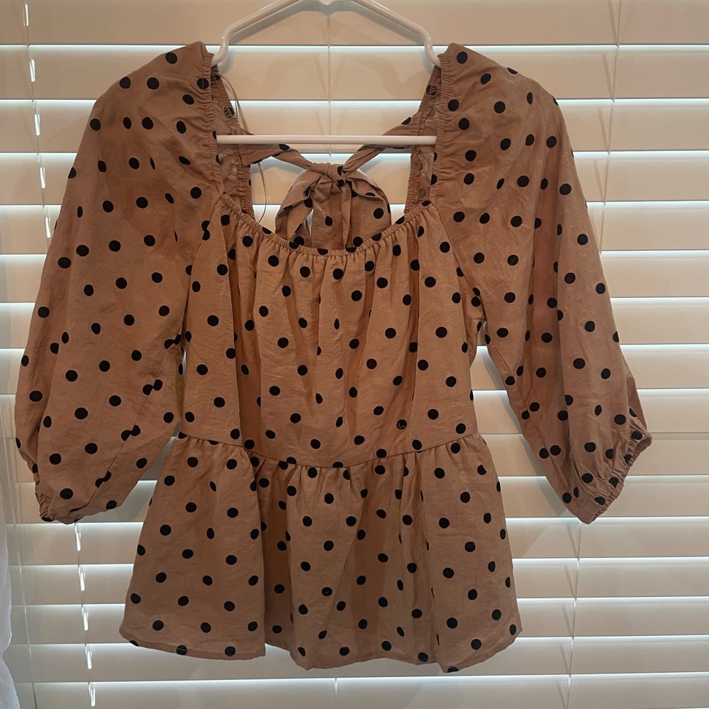 super cute cropped shirt with puffy sleeves and tie bow in the back